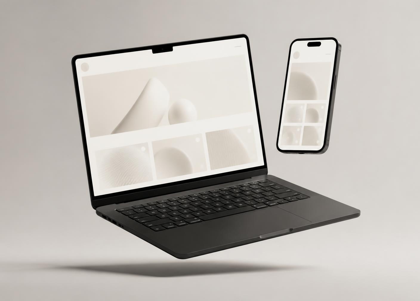 Laptop and phone displaying a modern responsive website design